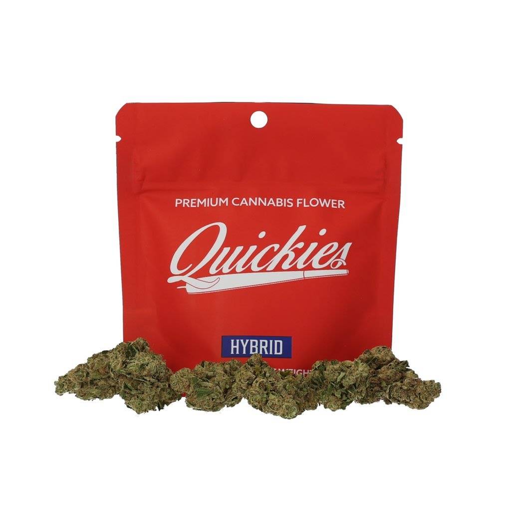 Quickies 1 Oz Premium Flower HYBRID cannabis buds displayed in front of a red resealable packaging. High-quality hybrid flower for relaxation and focus.